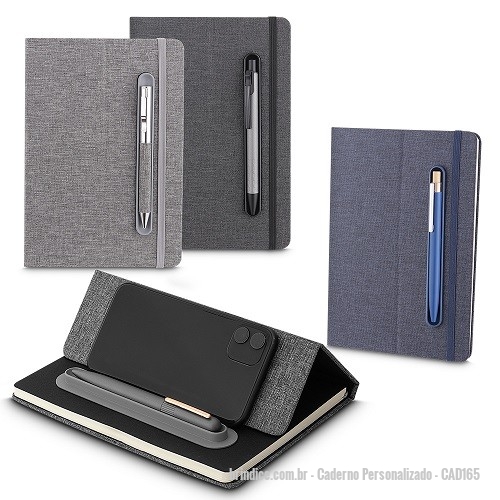 Caderno personalizado - Caderno Personalizado - CAD165 - Caderno produzido com capa em tecido RPET e suporte para caneta, capa dobrável para suporte de smartphone, miolo com 80 folhas pautadas. *Não acompanha caneta. - 169969 - Portal de Brindes Personalizados | Guia Bríndice 38 Anos - Caderno