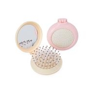 Escova de cabelo com espelho