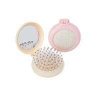 Escova de cabelo com espelho